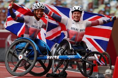 Tokyo 2020 Paralympic Games - Athletics - Women's 800m - T34 Final - Olympic Stadium, Tokyo, Japan - September 4, 2021.  Hannah Cockroft of Britain celebrates after winning gold and Kare Adenegan of Britain celebrates after winning silver REUTERS / Marko Djurica     TPX IMAGES OF THE DAY