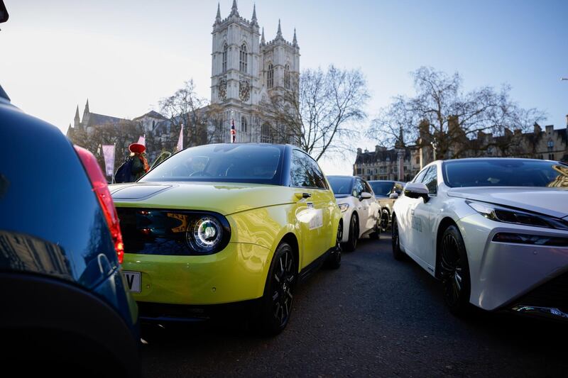 A range of electric automobiles parked in the Westminster district, during the launch of the Society of Motors Manufacturers and Traders (SMMT) Electrified 2021 Virtual Summit, in London, U.K., on Thursday, March 25, 2021. Carmakers are pushing for the U.K. to increase incentives for electric vehicles, arguing the country's plan to phase out cars powered by gasoline and diesel by 2030 can only be achieved by making EVs cheaper. Photographer: Jason Alden/Bloomberg