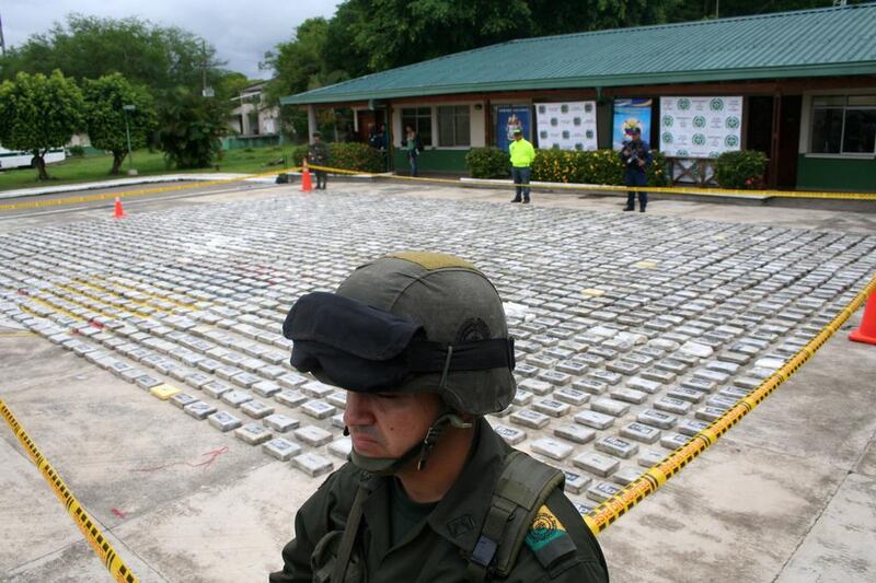 A soldier guards packets of cocaine in Colombia in 2011.  Nestor Silva / AFP