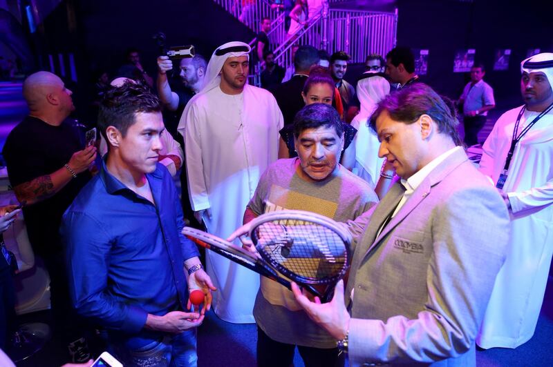 DUBAI, UNITED ARAB EMIRATES - MAY 28:  Diego Maradona speaks to Miguel Angel Rodriguez of Colombia during the men's final match of the PSA Dubai World Series Finals 2016 at Burj Park on May 28, 2016 in Dubai, United Arab Emirates.  (Photo by Francois Nel/Getty Images)