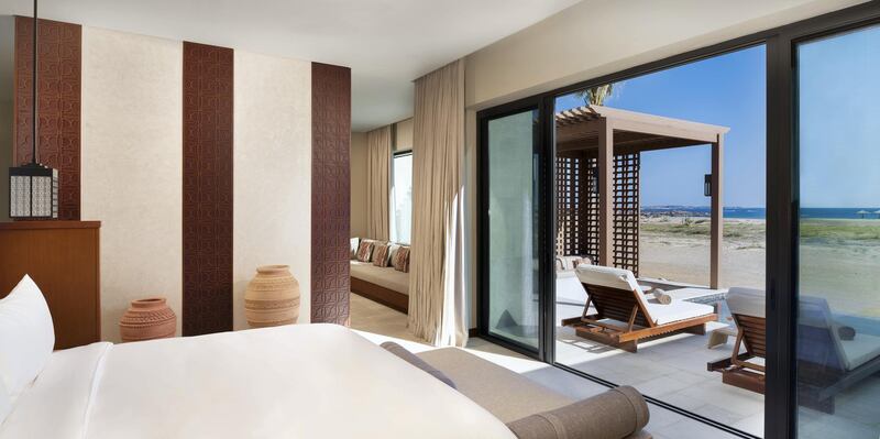 Spacious rooms and suites are contemporary with traditional Omani design features. 