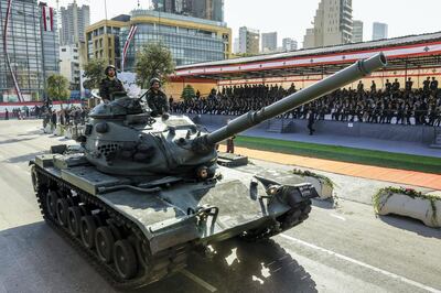 A Lebanese Army M60 tank drives down a military parade during an official ceremony commemorating the country's 73rd independence day in the capital Beirut, on November 22, 2016. (Photo by ANWAR AMRO / AFP)
