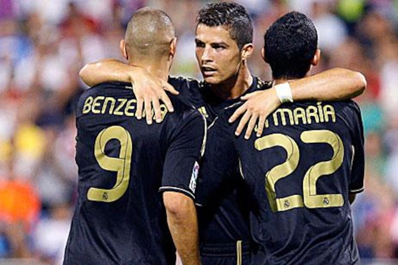 Cristiano Ronaldo, centre, celebrates scoring with Real Madrid teammates Karim Benzema and Angel Di Maria.