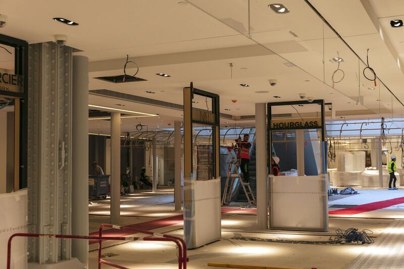 Cosmetic sales signs sit in a beauty product retail area inside the Samaritaine department store, operated by LVMH Moet Hennessy Louis Vuitton, during ongoing renovation work in Paris, France, on Tuesday, Nov. 19, 2019. The world’s biggest luxury group LVMH, controlled by billionaire Bernard Arnault--is set to reopen the Samaritaine department store next April after 15 years. Photographer: Laura Stevens/Bloomberg