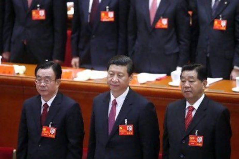 Xi Jinping, China's vice president, front centre, would face daunting challenges including slowing growth in the world’s second biggest economy, rising unrest among citizens and delicate relations with neighbouring countries.