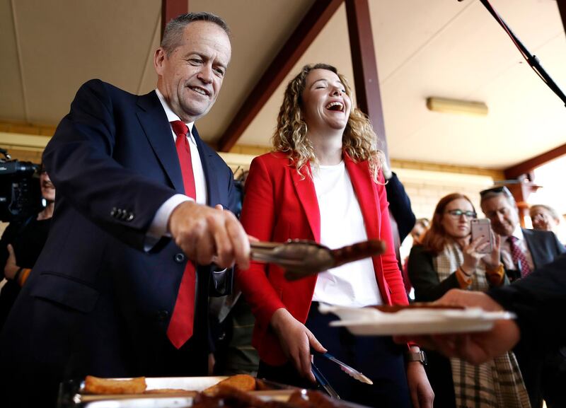 Labor Leader Bill Shorten and Labor candidate for Boothby Nadia Clancy hand out sausages to supporters during a community BBQ in Adelaide, Australia. Getty Images