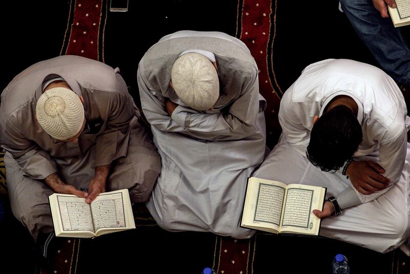 Lebanese Muslims read the holy Quran during the Laylat Al Qadr at the Muhammad al-Amin Mosque in Beirut, Lebanon, on June 12, 2018. Nabil Mounzer / EPA