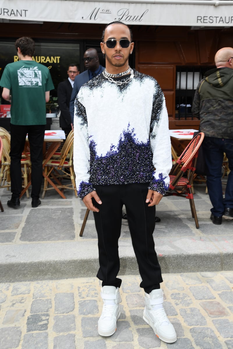 Lewis Hamilton, in a monochrome look by Louis Vuitton, attends the Louis Vuitton menswear spring/summer 2020 show during Paris Fashion Week on June 20, 2019. Getty Images