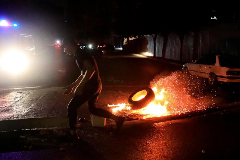 In a late night burst of anger, dozens of protesters blocked main roads in Beirut and north of the capital. AP Photo