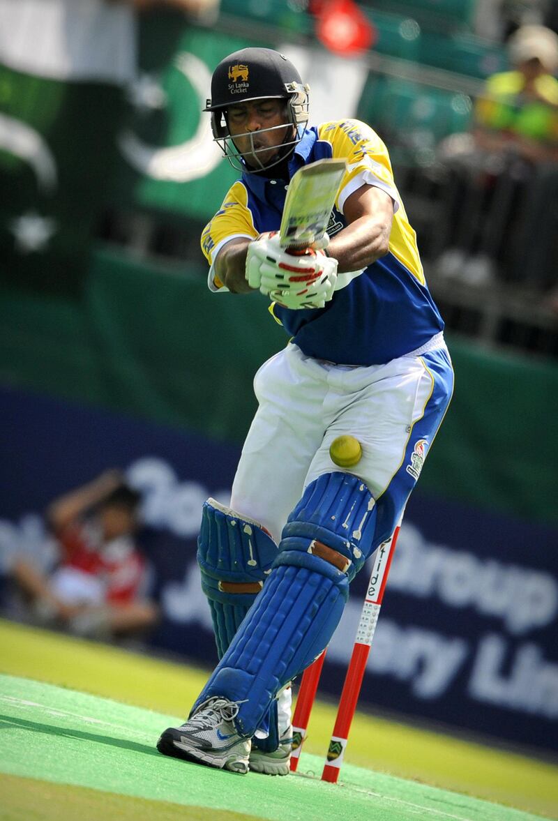 Sri Lankan batsman Dilhara Lokuhettige succumbs to a missed ball during their cricket sixes match against Pakistan on October 31, 2009 at the Kowloon cricket club in Hong Kong.  AFP PHOTO / ED JONES (Photo by Ed Jones / AFP)