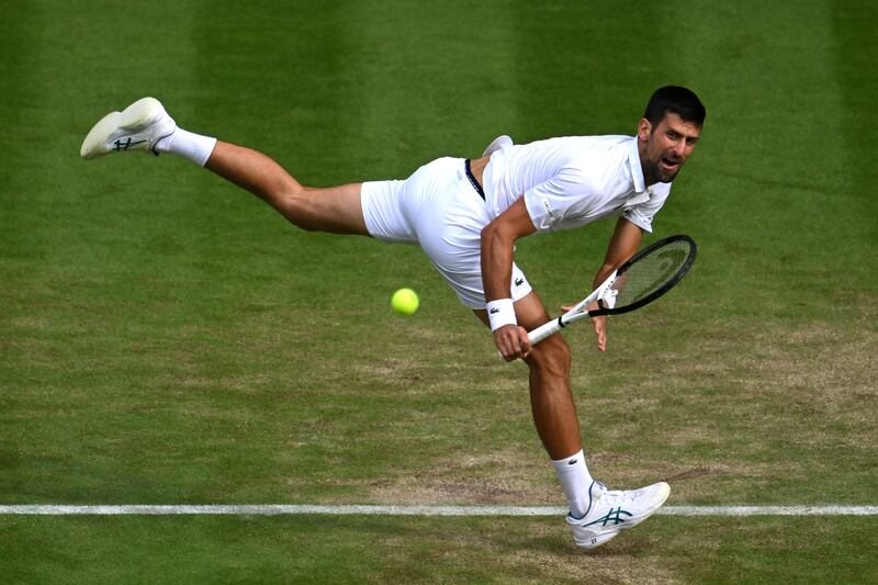 Novak Djokovic stretches to make a backhand. Getty 