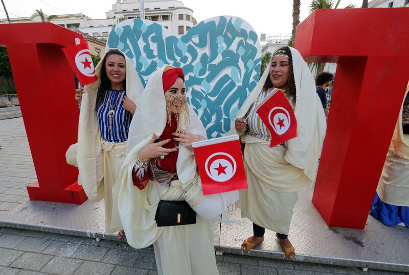 Tunisian women wearing traditional veils called 'Sefseri' celebrate National Women's Day in Tunis, Tunisia.  EPA