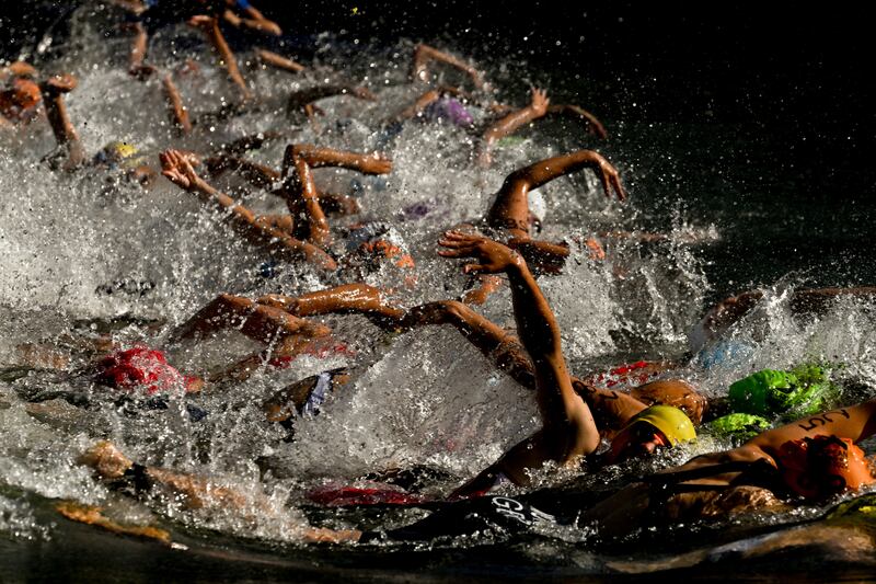 Athletes compete during the women's triathlon elite race at the European Championships in Munich, Germany. EPA