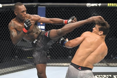 ABU DHABI, UNITED ARAB EMIRATES - SEPTEMBER 27:  (L-R) Israel Adesanya of Nigeria kicks the head of Paulo Costa of Brazil in their middleweight championship bout during UFC 253 inside Flash Forum on UFC Fight Island on September 27, 2020 in Abu Dhabi, United Arab Emirates. (Photo by Josh Hedges/Zuffa LLC)