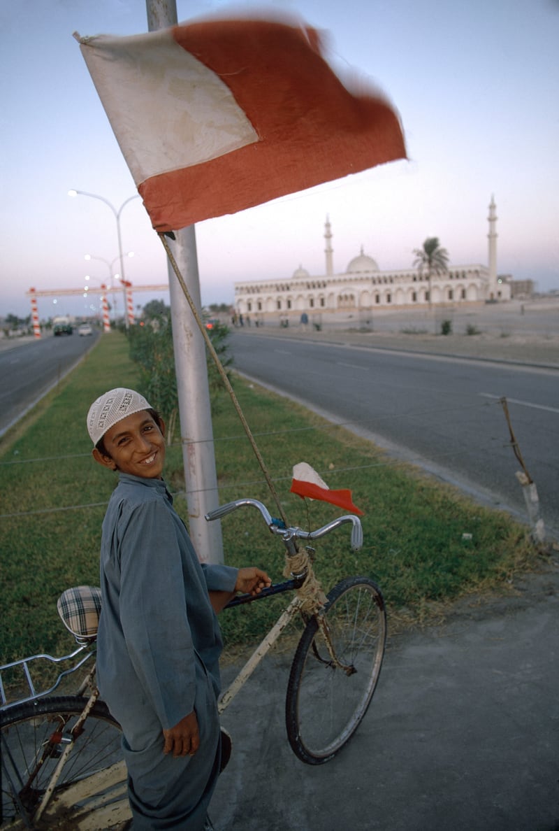 A boy in Dubai celebrates UAE independence in Dubaï in 1971. The flag attached to his bike is that of Abu Dhabi before the introduction of the UAE flag. Bruno Barbey / Magnum Photos / arabianEye.com