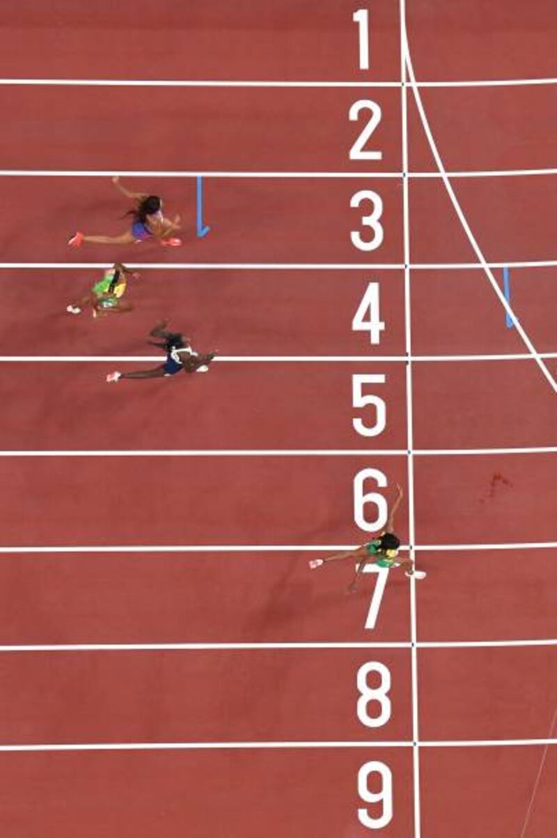 Jamaica's Elaine Thompson-Herah crosses the finish line to win the women's 200m final.