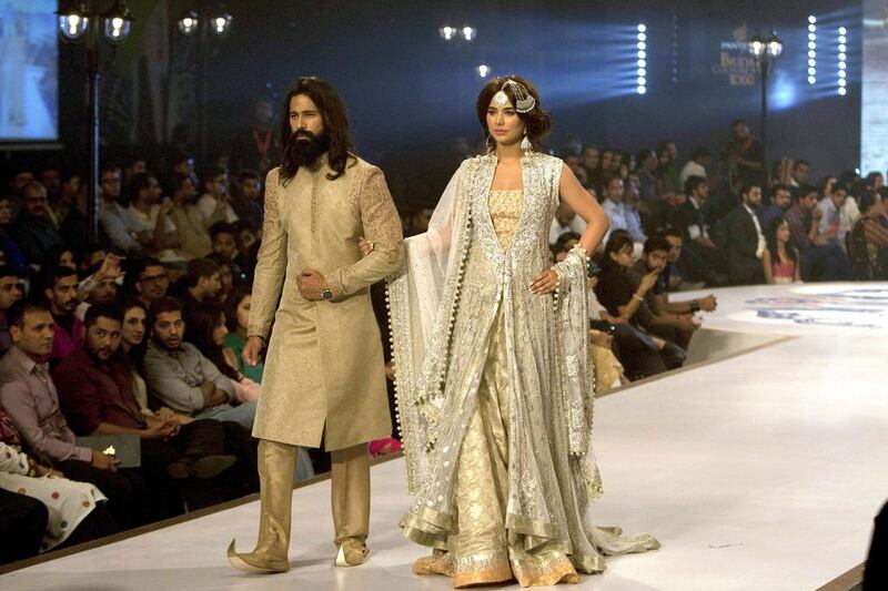 Models present creation by designer Sana Abbas. Shakil Adil / AP photo