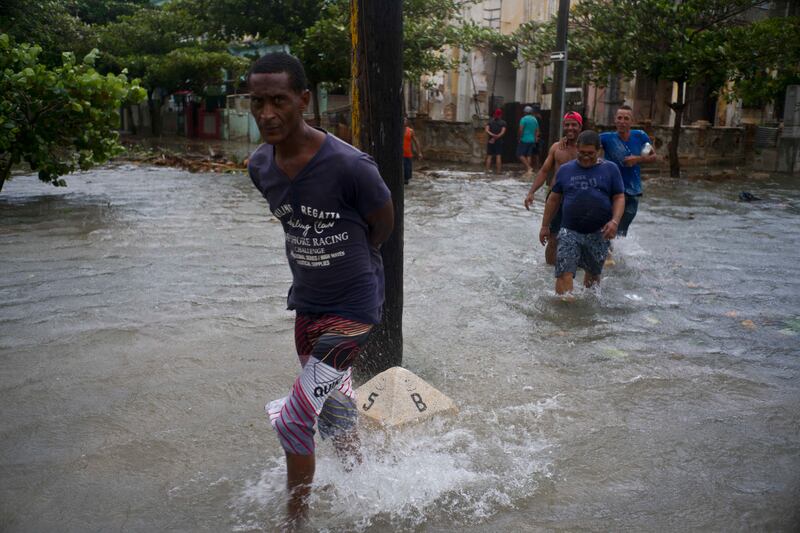 Men wade through a flooded street, caused by the passing of Hurricane Irma in Havana, Cuba. Ramon Espinosa / AP Photo