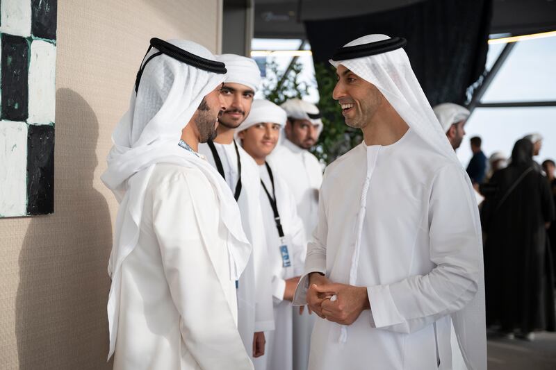 Sheikh Khaled bin Zayed Al Nahyan, chairman of the board of the Zayed Higher Organisation for Humanitarian Care and Special Needs, and Sheikh Khalifa bin Tahnoun Al Nahyan, executive director of the Martyrs' Families' Affairs Office, at Shams Tower. Photo: Rashed Al Mansoori /  UAE Presidential Court
