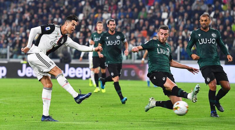 Juventus' Cristiano Ronaldo (L) scores the 1-0 lead during the Italian Serie A soccer match between Juventus FC and Bologna FC in Turin, Italy.  EPA