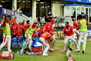 Kings XI Punjab Coach Anil Kumble and whole team at the dugout jumps with joy sand celebrates win over Mumbai Indians during match 36 of season 13 of the Dream 11 Indian Premier League (IPL) between the Mumbai Indians and the Kings XI Punjab held at the Dubai International Cricket Stadium, Dubai in the United Arab Emirates on the 18th October 2020. Photo by: Samuel Rajkumar / Sportzpics for BCCI