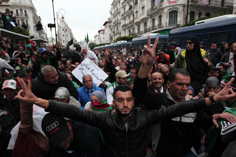 Demonstrators take to the streets in the capital Algiers to protest against the government and reject the upcoming presidential elections, in Algeria. AP Photo