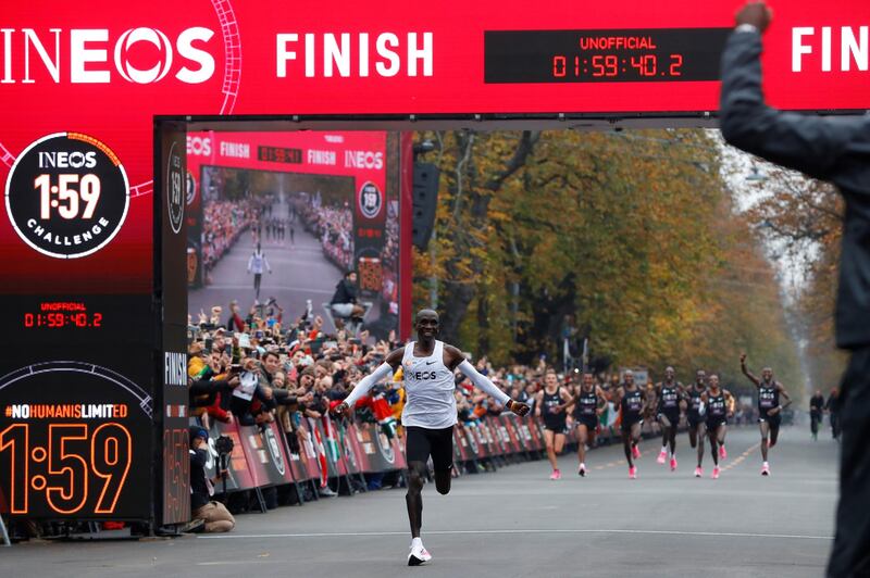 Kenya's Eliud Kipchoge, the marathon world record holder, crosses the finish line during his attempt to run a marathon in under two hours in Vienna, Austria. REUTERS
