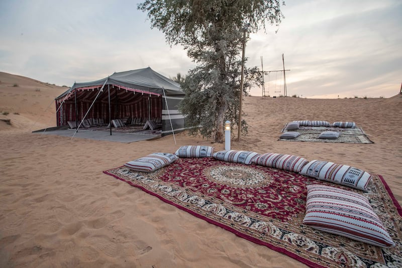 The venue features an 'old Emirates look' with traditional elements such as a Bedouin-style camp. 