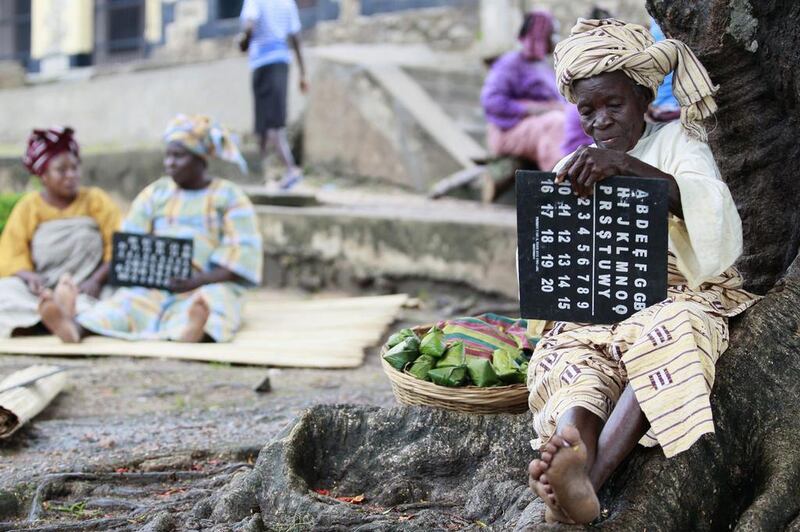 An actress holds a slate as she performs a scene during the making of ‘Ake’, a film based on the childhood memoirs of Nigerian writer Wole Soyinka, in Abeokuta, Nigeria.