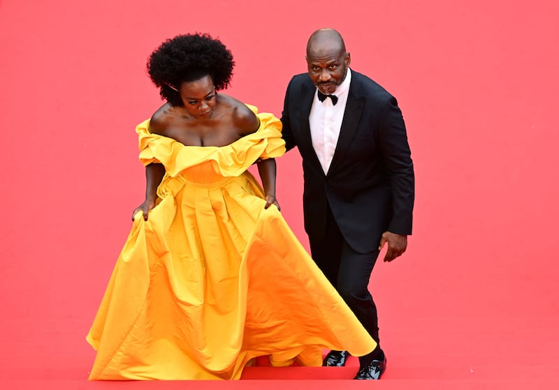 US actress Viola Davis, in custom Alexander McQueen, and her husband Julius Tennon arrive for the screening of Top Gun: Maverick. AFP