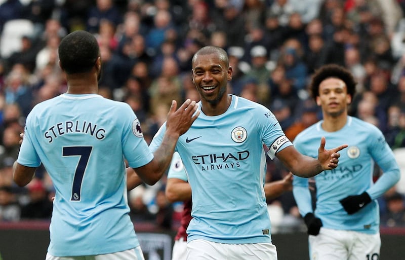 Soccer Football - Premier League - West Ham United v Manchester City - London Stadium, London, Britain - April 29, 2018   Manchester City's Fernandinho celebrates scoring their fourth goal with Raheem Sterling    Action Images via Reuters/John Sibley    EDITORIAL USE ONLY. No use with unauthorized audio, video, data, fixture lists, club/league logos or "live" services. Online in-match use limited to 75 images, no video emulation. No use in betting, games or single club/league/player publications.  Please contact your account representative for further details.