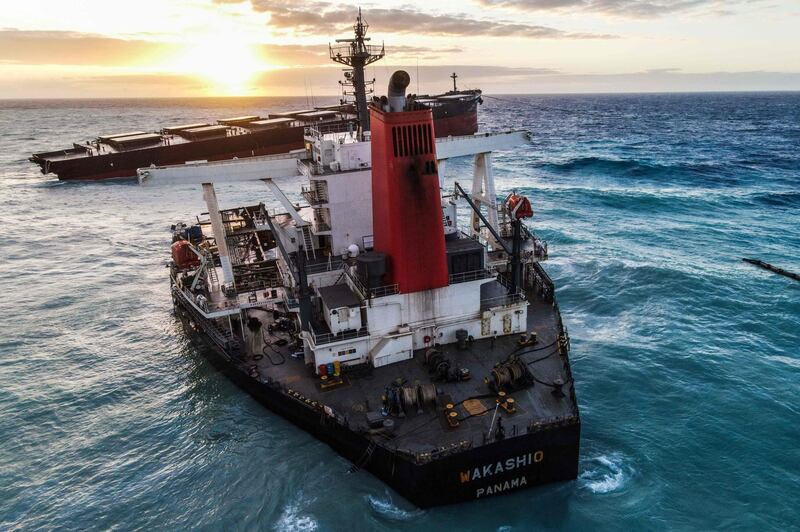 (FILES) In this file photo taken on August 17, 2020 An aerial view taken in Mauritius shows the MV Wakashio bulk carrier, belonging to a Japanese company but Panamanian-flagged, that had run aground and broke into two parts near Blue Bay Marine Park. On July 25, 2020, a cargo ship loaded with thousands of tonnes of fuel ran aground off Mauritius, beginning the worst environmental disaster ever witnessed in the tiny Indian Ocean archipelago.
Two months later, Mauritius is still taking stock of the damage after its rich fishing grounds and sensitive marine habitats were befouled with oil, and public anger simmers over the government's handling of the crisis. / AFP / -
