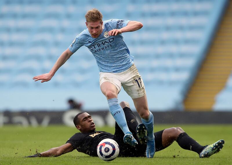 Manchester City's Kevin De Bruyne, front, duels for the ball with West Ham's Issa Diop. AP