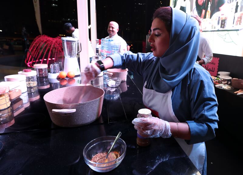 Shaida Ibrahim cooks during a competition