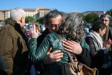 Family members and friends celebrate after a court acquitted nine leading Turkish civil society activists of terrorism-related charges related to anti-government protests, including Osman Kavala, an entrepreneur known for philanthropy, who was later rearrested. AP