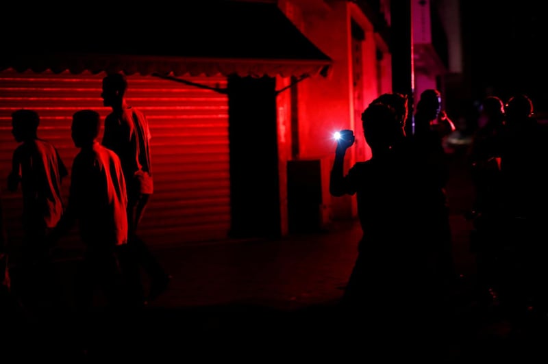 People walk on the street during a blackout in Caracas, Venezuela July 22, 2019. REUTERS/Carlos Garcia Rawlins