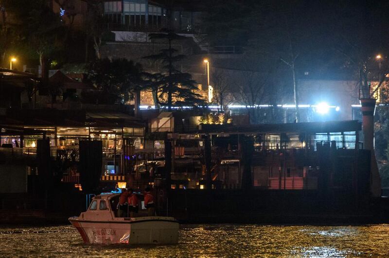 A Turkish coastguard vessel anchored near the Reina night club. Turkey has launched a manhunt for the assailant. Ozan Kose / AFP Photo