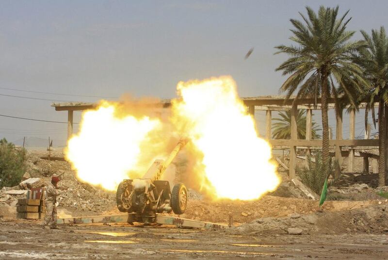 Iraqi security forces fire an artillery gun during clashes with the Al Qaeda-linked Islamic State in Iraq and the Levant (ISIL) in Jurf al-Sakhar, Iraq. Mushtaq Muhammed / Reuters