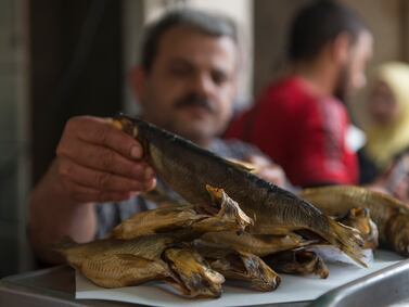 Fesikh, a kind of Egyptian salted fish, at a store in Cairo's Shobra district. It is typically consumed during Eid Al Fitr as a palate cleanser. EPA