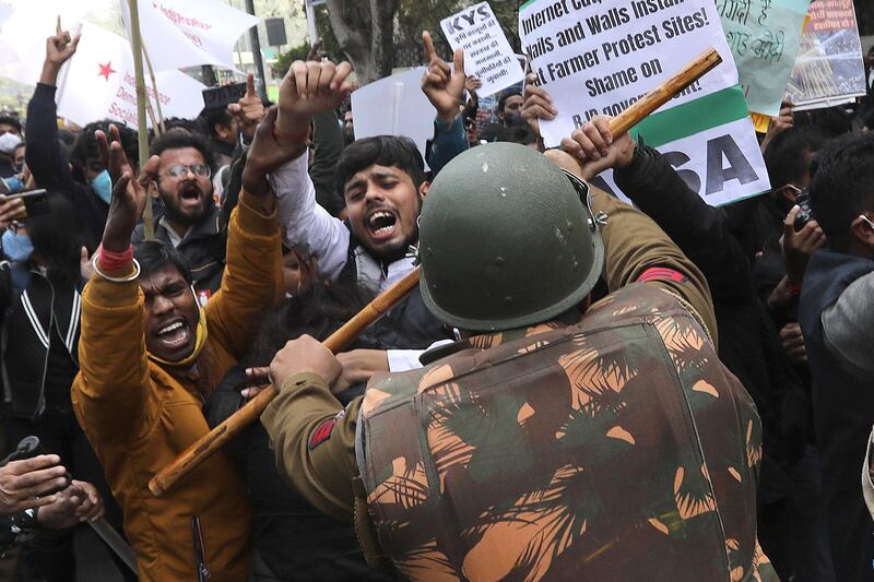 Security personnel clash with demonstrators during a rally in support of Indian farmers. The farmers are protesting at various locations at the capital, New Delhi. EPA