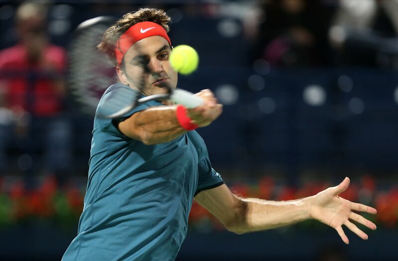 DUBAI , UNITED ARAB EMIRATES Ð  Feb 24 , 2014 : Roger Federer ( SUI ) playing against Benjamin Becker ( GER ) during the first round match of Dubai Duty Free Tennis Championships at Dubai Duty Free Tennis stadium in Dubai. ( Pawan Singh / The National ) For Sports. Story by Ahmed 