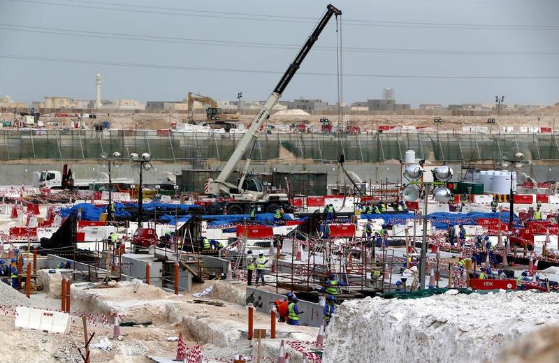 Labourers work at the construction site of the Al Wakrah football stadium, one of the Qatar's 2022 World Cup stadiums in May 2015. Marwan Naamani / AFP Photo