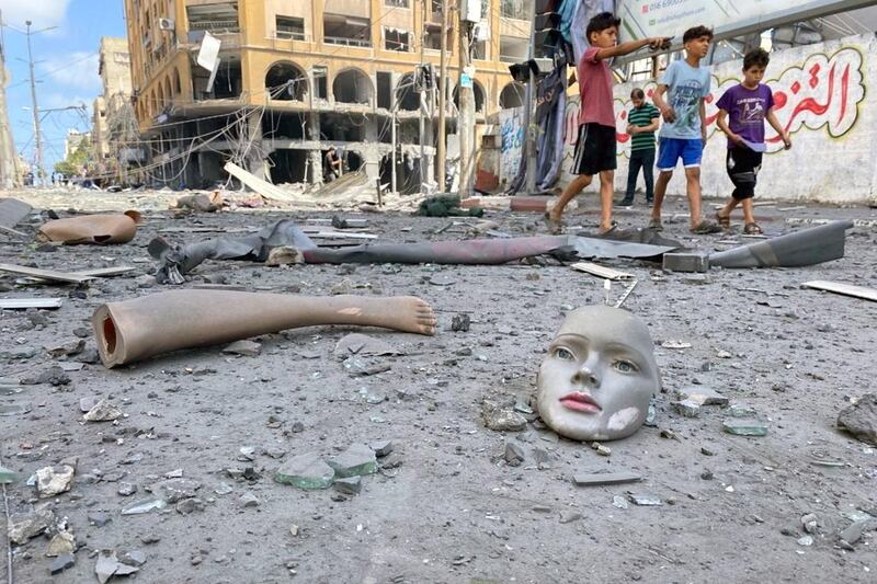 Parts of a broken mannequin lie scattered near a building that was hit by Israeli air strikes in Gaza city. Reuters