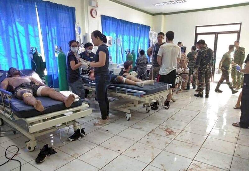 Bomb victims receive treatment in a hospital after two bombs exploded outside a Roman Catholic cathedral in Jolo, the capital of Sulu province in southern Philippines. AP