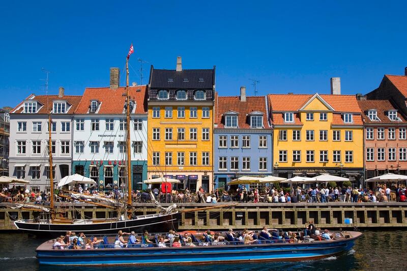 Tour boat in Nyhavn Canal, Copenhagen, Denmark. Getty Images