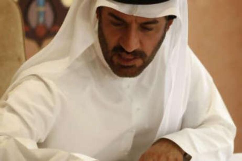 Mohammed ben Sulayem examines a map of Abu Dhabi's new Formula One track. The Yas Marina circuit will have a 50,000 seat capacity and will offer excellent facilitates for both spectators and drivers.