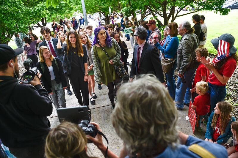 Youth plaintiffs in the climate change lawsuit arrive at the Lewis and Clark County Courthouse in Helena, Montana. AP