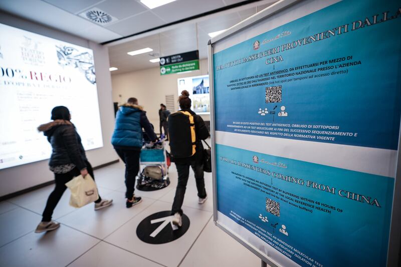 A notice for travellers arriving from China to undergo mandatory Covid tests at Caselle airport, in Turin, Italy.    EPA 