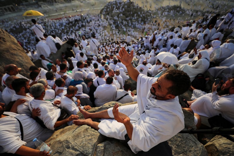 Pilgrims pray on the Mount of Mercy on the plain of Arafat. Reuters