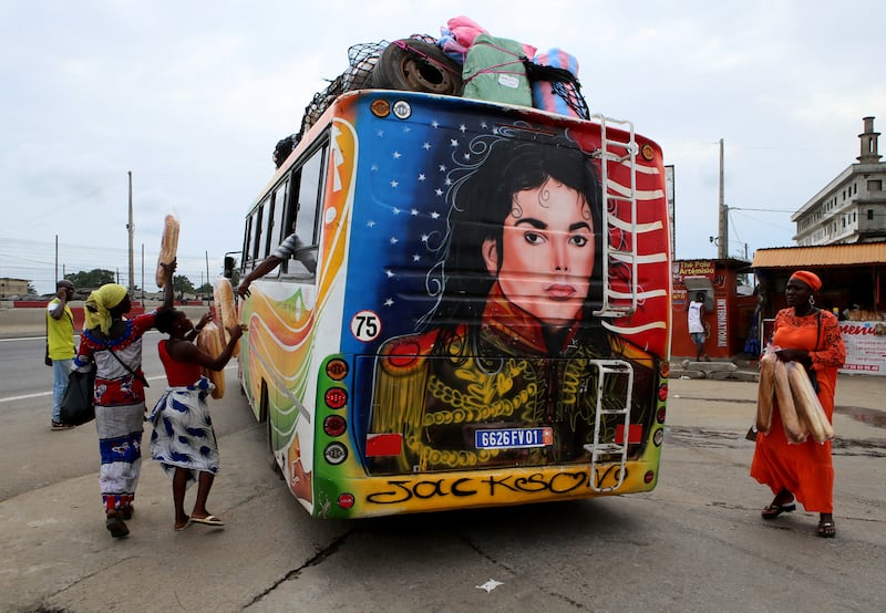A picture of Michael Jackson is painted on the back of a bus in Yopougon, a district of Abidjan, Ivory Coast. The King of Pop was crowned the real king of a village that he visited during a tour of the country in 1992. EPA